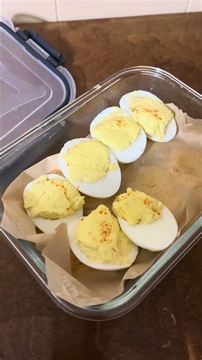 Deviled Eggs in Opened Container: Creamy Filled Egg Halves Homemade Lunch Pack View