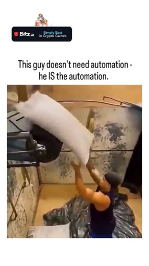 PixelMind_25 on Instagram: "The post showcases a 59-second video of a muscular worker in an industrial warehouse effortlessly lifting and stacking heavy white sacks—likely flour or cement—onto a conveyor belt at remarkable speed, amassing 7,499 likes and 2.8 million views in under 24 hours. The caption humorously portrays the man as a human embodiment of automation, emphasizing his robotic precision and agility in a manual labor context that contrasts with modern machinery. Indonesian-language r