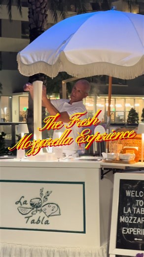 Introducing: The Fresh Mozzarella Experience🧀🧺🌱🥖 Watch as our seasoned cheesemaker hand-stretches fresh mozzarella curds before your eyes. Your guests then get to savor in and take the fresh batch home in our signature bags and boxes. Book yours at www.latabla.miami and leave your guests swooning. #freshmozzarella #mozzarellacheese #weddingreception #weddingreceptionideas #charcuterie