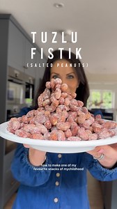 Tuzlu Fıstık: Salted Peanuts. The snack of my childhood. INGREDIENTS 650g large raw red skin peanuts 4 tbsp cold water 2 tbsp plain flour 1 1/2 tsp fine sea salt flakes METHOD: Preheat oven to 190°c fan / 210c. Add the peanuts to a large bowl, pour in the water and stir well so all the peanuts are fully coated. Sprinkle in the plain flour, stir well again until the water and flour form a white paste that covers all the peanuts. Keep stirring until there is no liquid left in the bowl. Stir throug