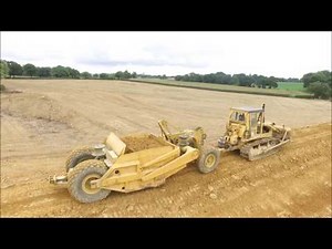 CAT D6D pulling scraper
