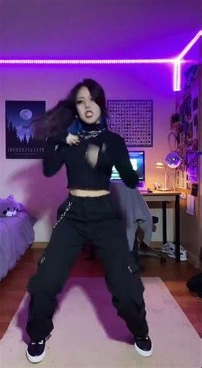 She performs sharp, rhythmic choreography perfectly synced to a heavy bass rap track