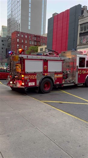 FDNY Engine 54 returning to quarters on 8th Avenue.