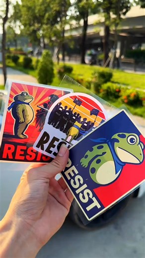 261 reactions · 3 comments | Hop into Resistance! ✊​​ Show your stance with the Portland Frog Protest Sticker—inspired by the fearless inflatable frog activists. Perfect for laptops, water bottles, and helmets, this anti-ICE, anti-fascism sticker screams "Frogs Together Strong!" Silence isn’t an option. Stick your statement. ​​#PortlandFrog #ProtestSticker #AntiFascism #ICEFree #SolidarityInStickers | Acreatmore-ss | Facebook