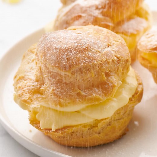There's always time for LEMON CREAM PUFFS. 🍋 The light and fluffy lemon filling will send your taste buds soaring! --> https://laurenslatest.com/lemon-cream-puffs/ | Lauren's Latest