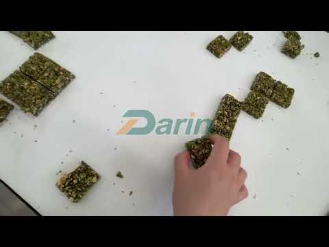 Cereal bar cutting machine with sesame sprinkling