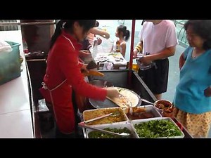 Cooking Chinese Crepe Jian Bing on street in Shanghai.MOV