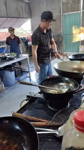 Exciting Wok Cooking Techniques in an Industrial Kitchen