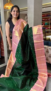 A stunning pure Kanchipuram silk saree in dark forest green, adorned with gold zari buttas that shimmer with every fold. The contrast borders, pallu, and blouse come in a soft peach-pink tone, richly woven in pure gold zari detailing that adds a graceful glow. A perfect blend of bold and delicate charm in one timeless drape. DM us @kanchivaram.in or call us to place your order or for any queries. Virtual appointments available to explore our in-store collection up close. 🟢 91 89212 43414 🟢 91