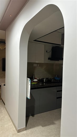 DeCore Designs - Interior Designing on Instagram: "Why settle for a normal entrance to your spectacular kitchen? We’ve not only curved the wall , but we’ve also curved the corner edges making sure it’s user friendly for all age groups. #interiordesign #interiors #explorepage #trending #trendingreels #decor #instamood #insta #mumbai #arch #architecture #virall #instagram #fyp"