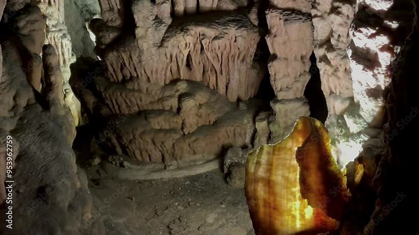Background. Inside the cave. Camera movement, vertical panorama of the stone structures of the cave 02