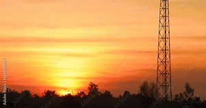 beautiful sunset, a large sun against the natural background of countryside