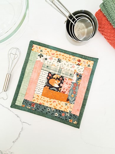 Let's make a log cabin pot holder. 🧵 Starting with a 2.5" square on top of a layer of batting and Insul-Bright, I added 1.5" wide fabric strips one at a time to make a log cabin quilt block. I then added backing and quilted the layers using a diagonal crosshatch design. So cute and easy! Fabric: Acorn Hollow by @official_basicgrey for @modafabrics #centerstreetquilts #sew #sewing #sewingtutorials #quilt #quilting #easysewing #easysewingproject | Center Street Quilts