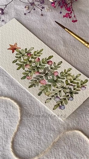Watercolor inspiration on Instagram: "Unusual Christmas tree drawing tutorial👇 This stunning watercolor creation by Padmini @bluebellarts reimagines the classic Christmas tree as a graceful, organic form made entirely of delicate leaves. It’s a beautiful fusion of botanical accuracy and festive spirit - perfect as a standalone piece of art or a uniquely thoughtful holiday card. About the artist.❤️ Padmini’s journey is as fascinating as her art. A former microbiologist, she brings a scientist’s 