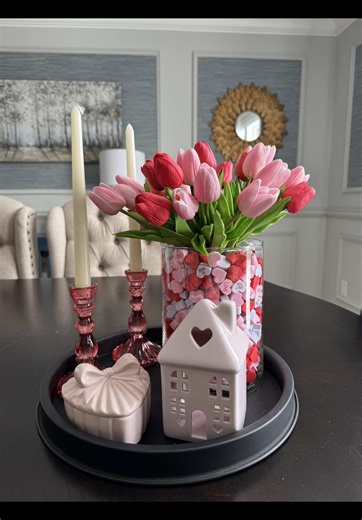 This Valentine's centerpiece is so easy to recreate! Everything is linked in my bio. I love how the foam conversation hearts look peeking through the vase, it adds such a fun pop of color! This is perfect if you want to make your space feel festive without going overboard.