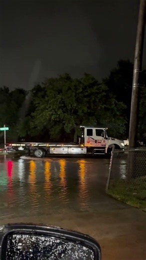 Wild video shows tow-truck navigating impassable, flooded road in Houma