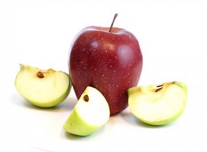 Rotating green and red apple isolated on a white background, loopable