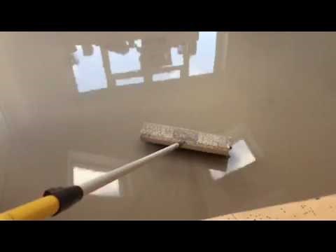 Self levelling compound and spiked roller to perfect a subfloor