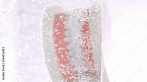 Jaw model in a sparkling water. Moving bubbles. Closeup. Slow motion