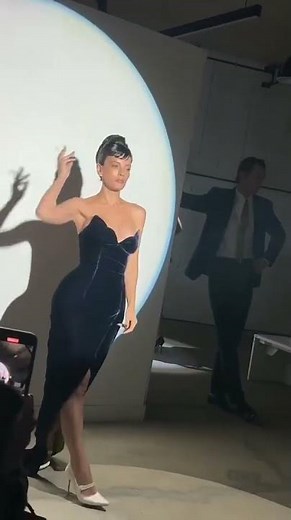 Lily Allen 'an icon' as she struts down the catwalk smoking a cigarette in a 'Diana revenge dress'