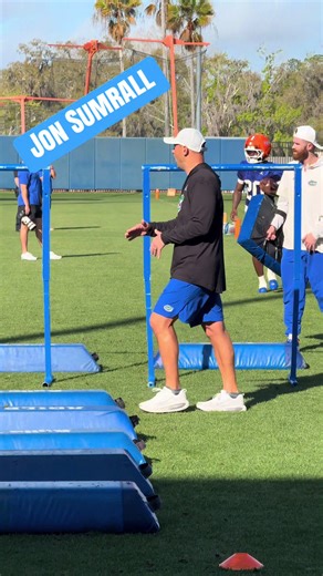 #FloridaGators coach Jon Sumrall coaching up the running backs at practice Thursday. #GoGators #Football