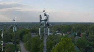 Cellular and Internet tower with antennas and Dish Tv for transmitting 3G, 4G or 5G signals, aerial shot.