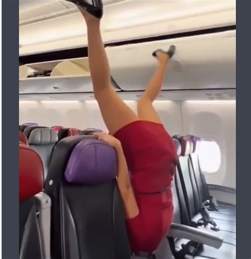 Amazing Yoga Feat: Flight Attendant Shuts Overhead Bins With Her Feet - View from the Wing