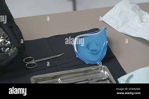 Tools for installing the cofferdam (rubberdam and clamp) lying on the table a Stock Video Footage - Alamy