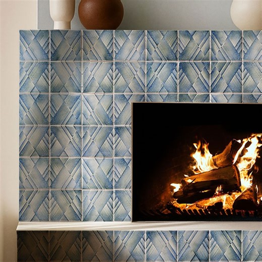 Ceramic Tile Design: San Rafael Showroom | As winter begins to fade, spaces like this remind us what’s ahead. This fireplace is wrapped in blue prism-like tiles that bring depth,... | Instagram