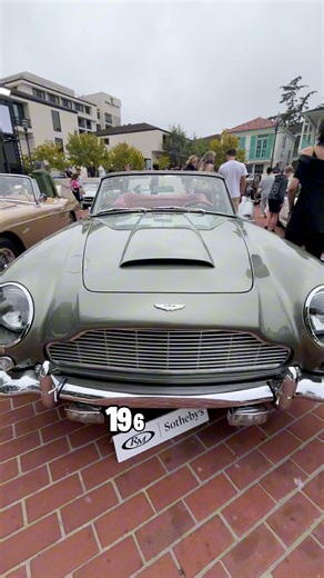 The Aston Martin DB5 debuted in 1963 and quickly became the benchmark for grand touring cars, showcasing Touring’s Superleggera body design, a 4.0-liter inline-six producing around 283 horsepower, and a five-speed manual transmission. This particular DB5 Convertible, chassis 2111/L, served as Aston Martin’s display car at the 1965 Barcelona Motor Show. It was originally finished in California Sage with a Red Connolly leather interior and came equipped with both a soft top and a rare steel hardto