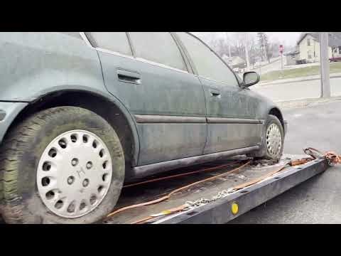 1993 Honda Accord lx. Getting it off the Rollback.
