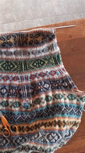 Hazel Tindall on Instagram: "I've been adding extra loops (aka steek stitches) to my knitting for many, many years. I can't remember if I was nervous or anxious the first time I cut my knitting - probably not as I'd have seen my mother do it. This will become a sleeveless top. Adding the extra loops after reaching the armhole openings means I can continue to knit in the round with the right side facing. Loop is the Shetland word for a knitted stitch. #fairislefriday #cutyourknitting #fairislehan