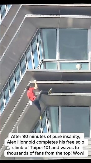 Alex Honnold completes his free solo climb of Taipei 101 in 90 min and waves to us from the top