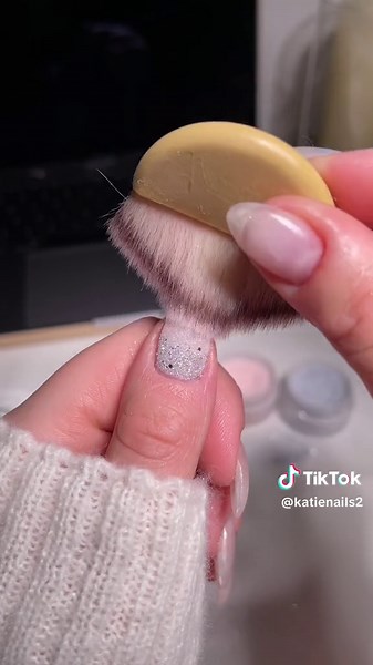 detailed steps below 👇🏻🎀🪩 Comment Link and I will send you everything I used to create this look. You can use code KATIESNAILS for a discount on your @Sassy Saints dip kit. 🤍 First you will paint base coat over the whole nail. Then dabbing the brush into the powder you will pick up enough so when you bounce the brush over where you want it on the nail the powder will fall. Pick up your second color and repeat this technique. Pick up the third color and do the same. When letting the powder f