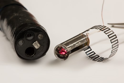 Microrobotic Laser-Steering Medical Device for Minimally Invasive Surgery