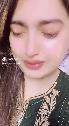 Elegant Dark Green Garment with Gold Embroidery