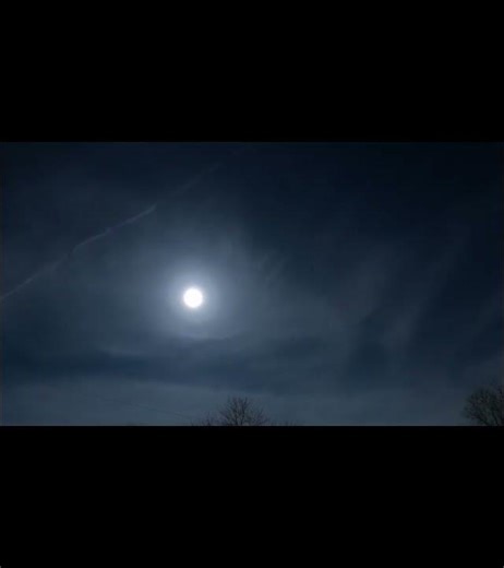 Time lapse of moon with clouds in night sky