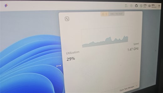 Windows 11 is testing an optional Dock that sits on the top of the screen with music playback control, CPU, GPU, RAM stats, and more