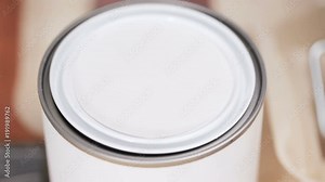 Paint swatches with purple paint sample and metal can with paint