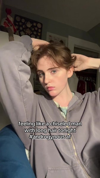 Embracing Androgynous Style: Chiseled Man with Long Hair