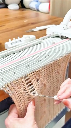 Using a Small Latch Hook Tool to Repair a Dropped Stitch on a Knitting Machine