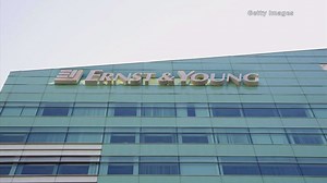 Ernst & Young settles charges tied to former employees