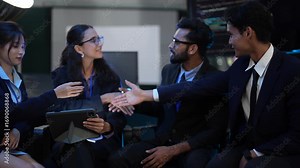 An AI research team reviews the architecture of a new neural network. They analyze the model's training results and plan the MLOps deployment strategy for their deep learning project.