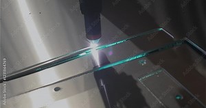 The plasma cutter will cut the part. Plasma cutting. Plasma cutter work at the factory. The process of cutting a metal part with a plasma cutter