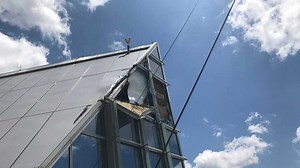 Photos show damage at Devon Tower after window-washers' harrowing rescue