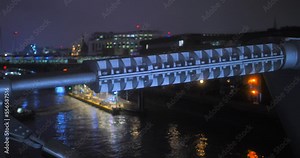 Closeup Detail Of The Steel Barrier Design Of Millennium Bridge At Night In London, United Kingdom.