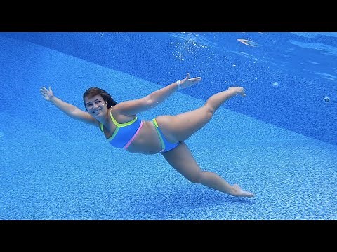 Swimming Underwater in a Neon Blue Bikini