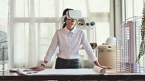 Architect young woman working with virtual reality technology modeling software applications in the office. Use augmented reality modeling in Building Information Model (BIM) tech system complete. vídeo do Stock