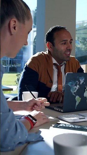 Business Meeting in Progress: Man Leading Discussion with Team | 4K Royalty-Free Stock Video