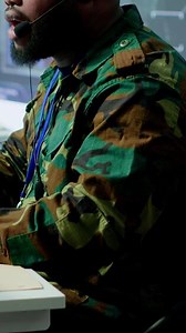 Vertical Military control room features army personnel monitoring surveillance systems, soldiers integrating data and coordinating strategic missions. Support decision making and efficiency. Camera A.